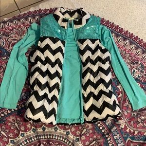 A long sleeve shirt with a cute vest on top